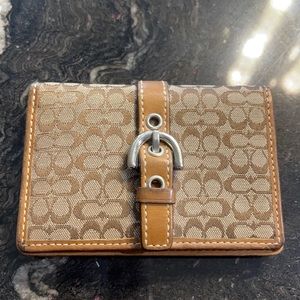 Used, brown coach card holder.